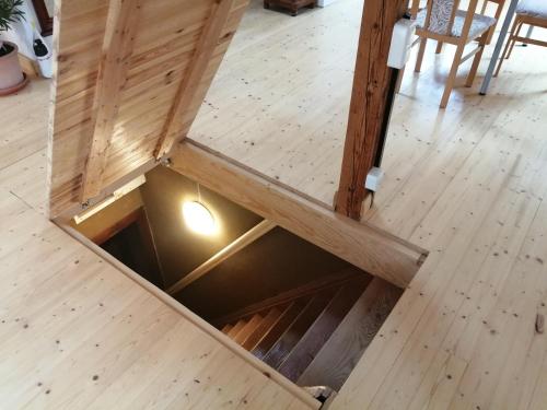 a drawer in a wood floor with a light in it at Haus Schmeile in Magdeburg