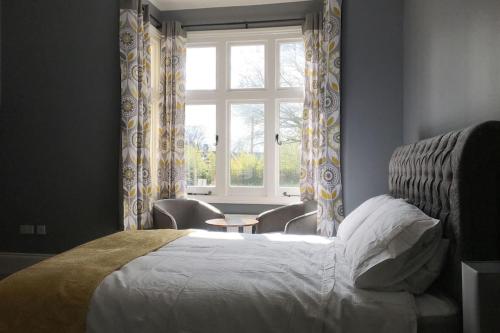 a bedroom with a bed and a window at Stylish 2 Bed Apart In The Heart of North Norfolk in North Walsham