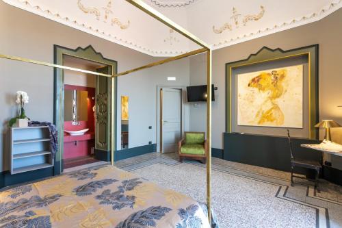 a bedroom with a bed and a desk in a room at 81 Suite and Breakfast in Catania