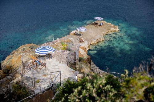 an aerial view of an island with umbrellas and the ocean at Residence Intur in Marciana Marina