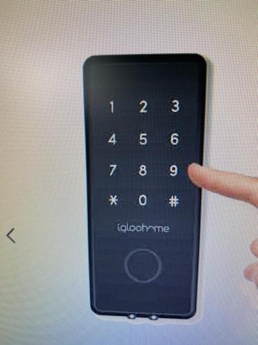 a person holding a remote control with their finger at Superbe Appartement au pied des pistes 25m2 in Bolquere Pyrenees 2000