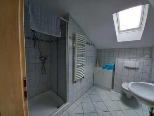 a bathroom with a shower and a sink at Haus Maier in Marquartstein