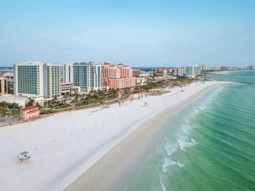 an aerial view of a beach with buildings and the ocean at NEW Beach Condo 5 min walk to the Beach Sleeps 9 in Clearwater Beach