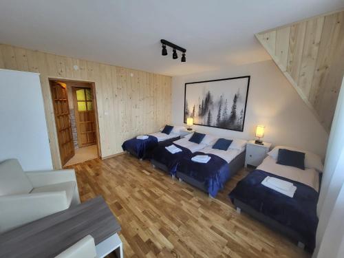 Postel nebo postele na pokoji v ubytování Apartament z widokiem na panoramę Tatr "AppWidokowa9"