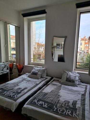 Ένα ή περισσότερα κρεβάτια σε δωμάτιο στο Center palais