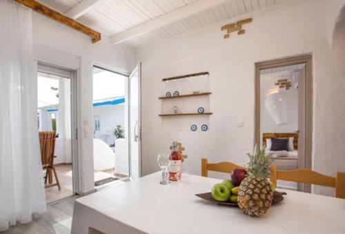 a kitchen with a table with a pineapple on it at Faliraki Blue Villas in Faliraki