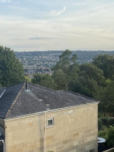 a roof of a building with a city in the background at Charlecote House in Bath