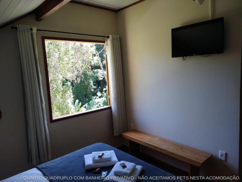 Cama ou camas em um quarto em Pousada dos Anjos