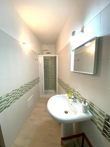 a bathroom with a sink and a mirror at Bed & Breakfast La Rocca in Taormina