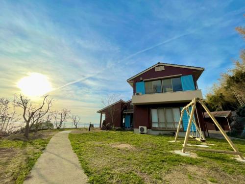 a house with a playground in front of it at BLUE AMALFI - Vacation STAY 28035v in Ōbe