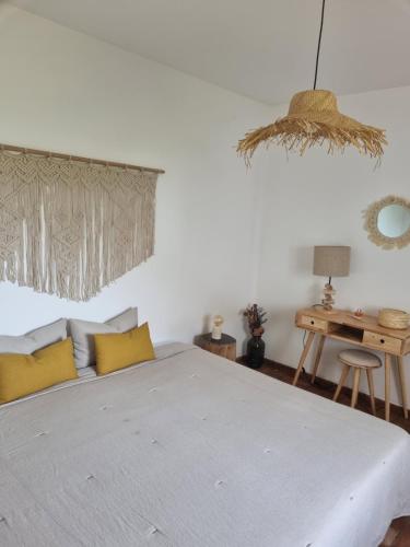 Ένα ή περισσότερα κρεβάτια σε δωμάτιο στο Cosy Guest House - Villa das Alfarrobas