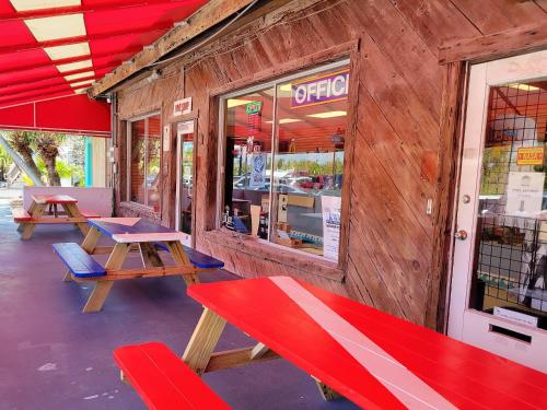 a store with tables and benches outside of it at Looe Key Reef Resort and Dive Center in Summerland Key