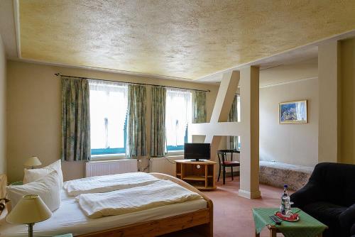 Postel nebo postele na pokoji v ubytování Ostseehotel Neubukow