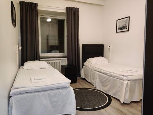 Postel nebo postele na pokoji v ubytování Alexi Apartments - Newly Renovated Apt in the Heart of the City near to Railway Station and Nokia Arena