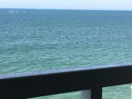 a view of the ocean from a balcony at Studio (Coup de Coeur) Wimereux in Wimereux