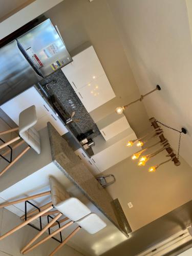 an overhead view of a kitchen with a spiral staircase at Almaza bay Beach Town Chalet in Marsa Matruh