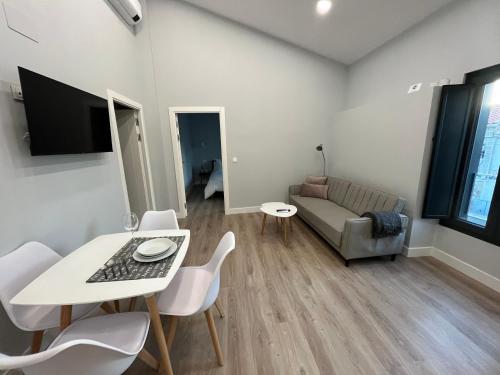 Televisyen dan/atau pusat hiburan di Apartments BICO DE RODAS a Rural Luxury