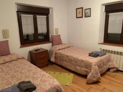 Кровать или кровати в номере Casa de Chelo y Eladio