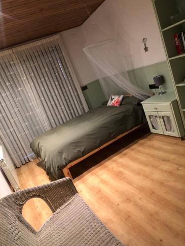 a bedroom with a bed with a mosquito net at Corral de Jaume in Àger