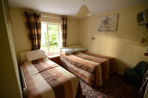 Postel nebo postele na pokoji v ubytování Haywoods B&B