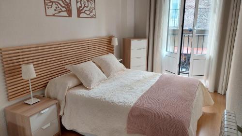 Ένα ή περισσότερα κρεβάτια σε δωμάτιο στο Ibarrenea Apartamento