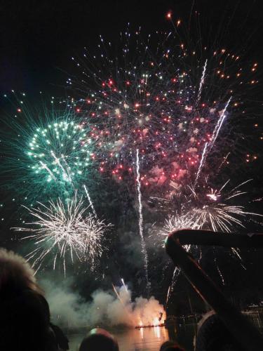 a group of people watching a fireworks display at Studio lumineux proche port & plages in Bénodet