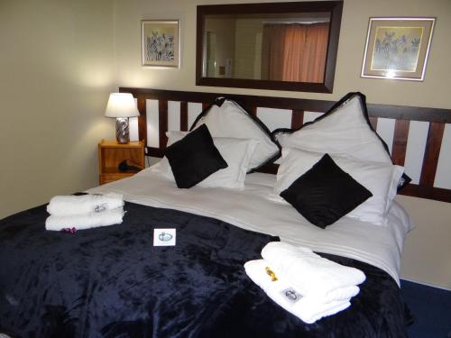 Ένα ή περισσότερα κρεβάτια σε δωμάτιο στο Obrigado Guest House