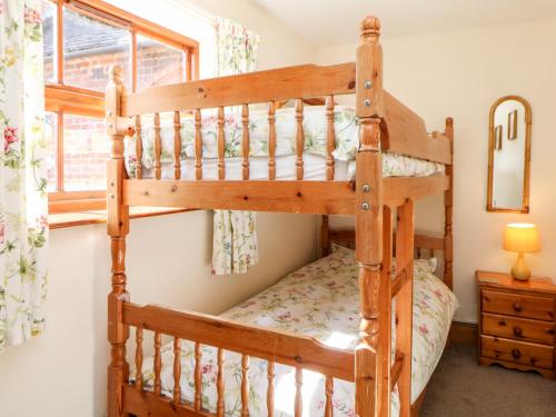 Posteľ alebo postele v izbe v ubytovaní Orchard Cottage