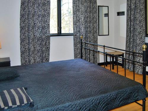Postel nebo postele na pokoji v ubytování Holiday home Vittsjö IV