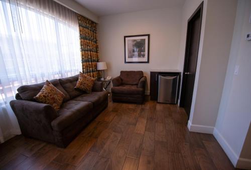 a living room with a couch and a chair at Hotel America in Tijuana
