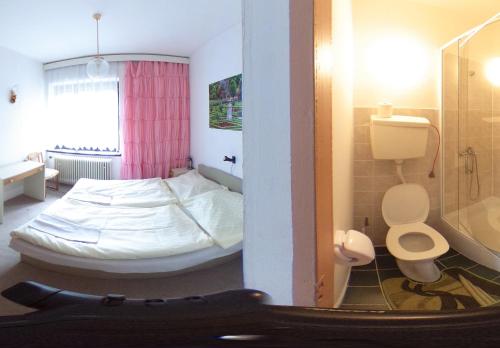 Postel nebo postele na pokoji v ubytování Penzion Heřmanice