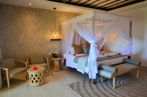 Postel nebo postele na pokoji v ubytování Neptune Pwani Beach Resort & Spa Zanzibar - All Inclusive