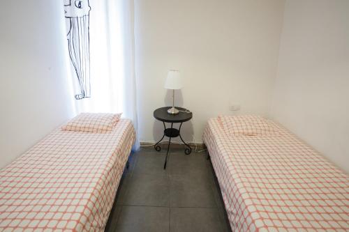 Postel nebo postele na pokoji v ubytování Barbieri Sol Hostel