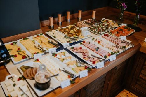 a buffet of different types of food on a table at Hotel nad Wisłą in Tczew