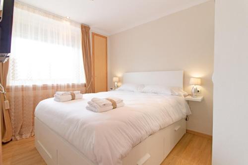 Postel nebo postele na pokoji v ubytování Global Properties, Apartamento Ideal Familias en Canet Playa