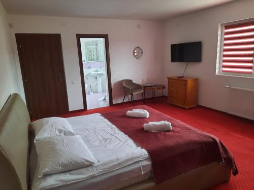 Ένα ή περισσότερα κρεβάτια σε δωμάτιο στο Cabana Donca