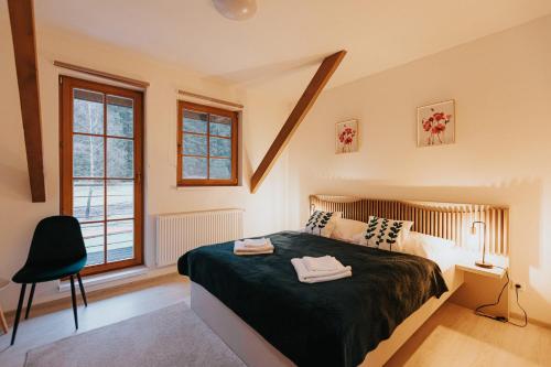 A bed or beds in a room at Orava Village