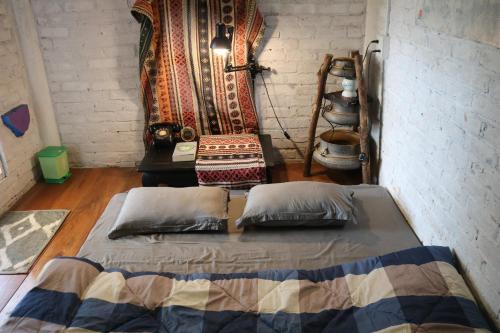 Tempat tidur dalam kamar di Le Home