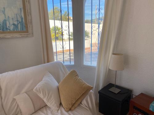 Postel nebo postele na pokoji v ubytování Jávea Villa entière piscine et cuisine d'été à pinosol