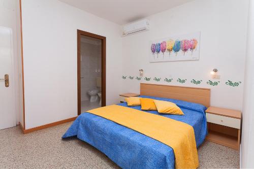 Giường trong phòng chung tại Hotel Amalfi & Dépendance