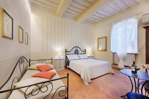 Кровать или кровати в номере I Merli di Ada