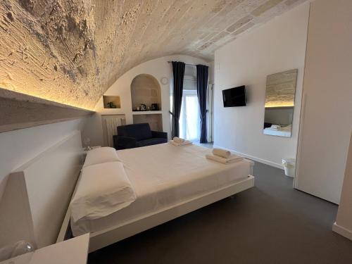 Postel nebo postele na pokoji v ubytování Il Giramondo Suite&Room self check-in