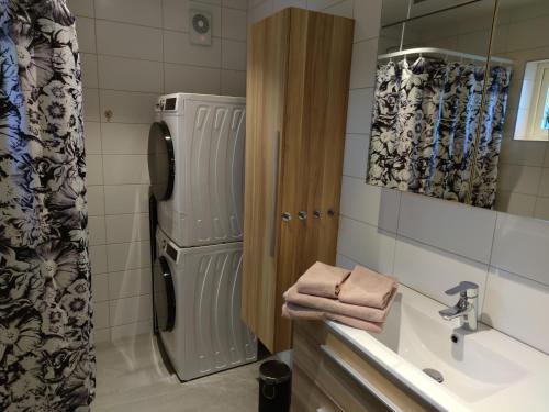 a bathroom with a sink and a toilet and a shower at Newly built accommodation in Skrea - Falkenberg in Falkenberg