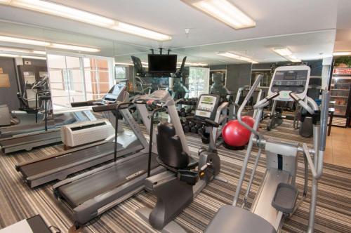 a gym with treadmills and cardio equipment in a building at Sonesta Simply Suites Anaheim in Anaheim