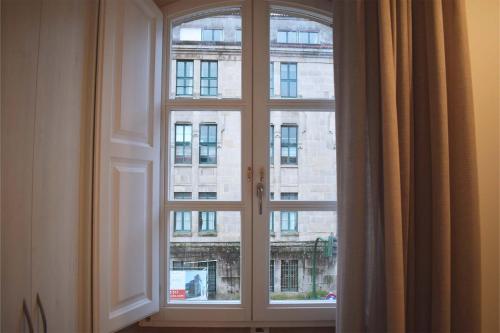 a window with a view of a building at Santa Filomena in Santiago de Compostela