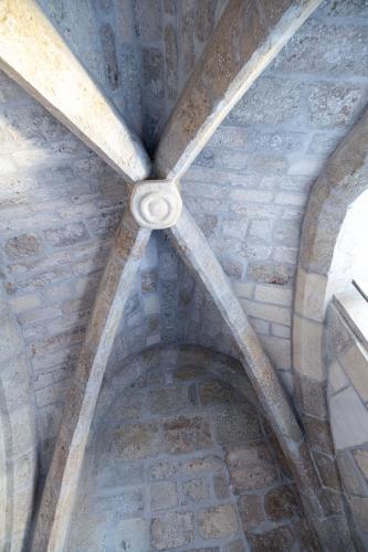 an attic of a building with a vaulted ceiling at Suite Impériale Église du Couvent in Narbonne