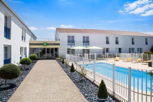 A view of the pool at ibis Styles Marennes d'Oléron or nearby