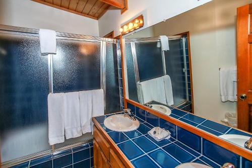 a bathroom with a sink and a mirror at Switzerland Ski Chalet-845 by Big Bear Vacations in Big Bear Lake