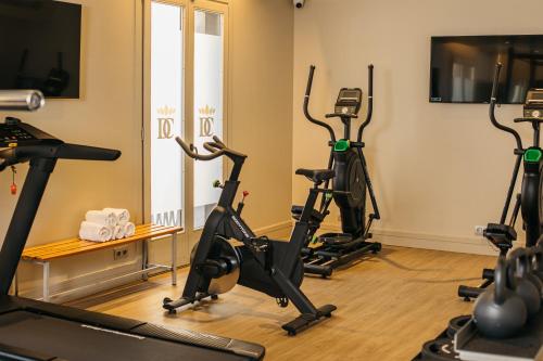 a room with treadmills and exercise bikes in it at Duquesa de Cardona 4* Sup in Barcelona