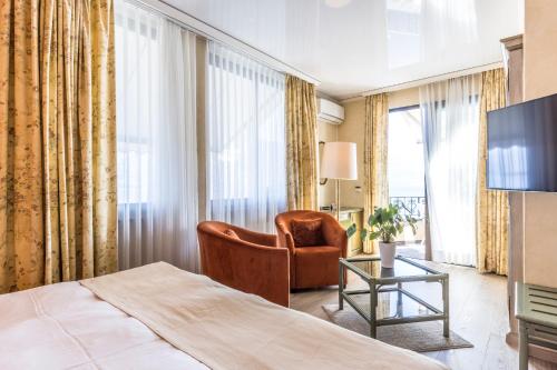 TV a/nebo společenská místnost v ubytování Boutique Hotel La Rocca